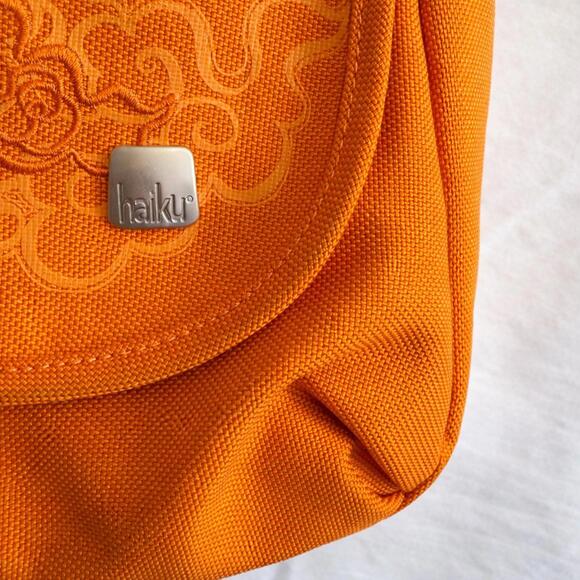 Haiku Jaunt Orange Crossbody Bag with Floral Embroidery - Picture 2 of 4